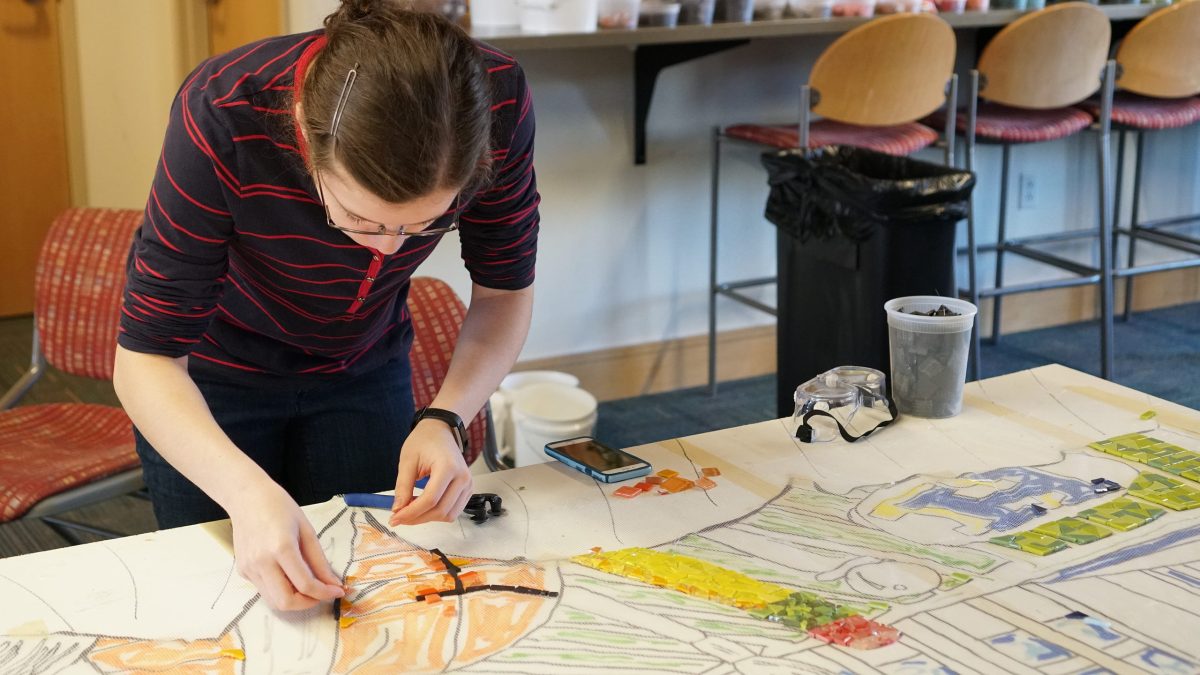 Hamilton students learn the power of community art through the creation of a mosaic mural