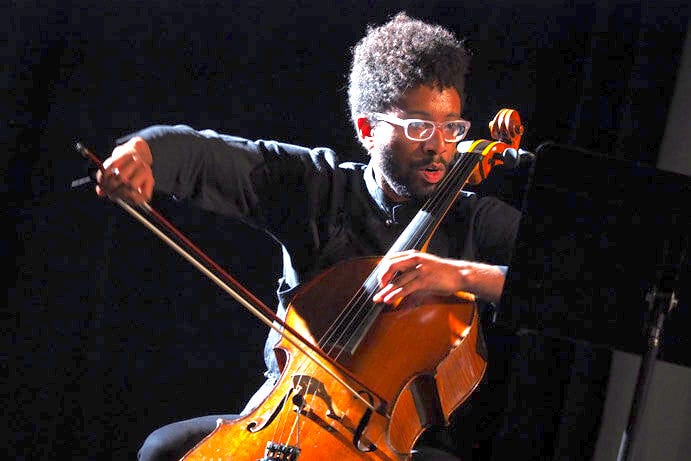 Cellist Seth Parker Woods stops at the Hill during his tour of the musical world